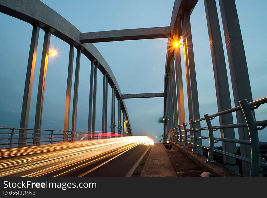 Light trails at kuala Kedah Bridge captured at dusk.