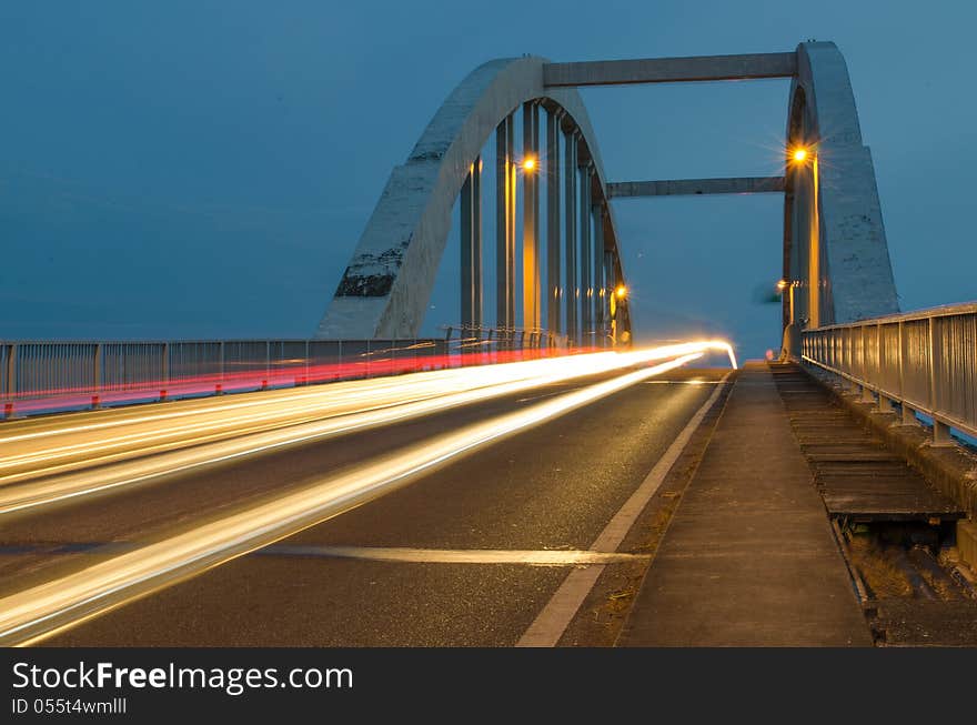 Light trails at kuala Kedah Bridge captured at dusk.