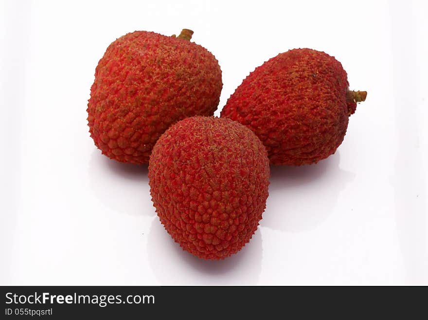 Fresh lychees on white background