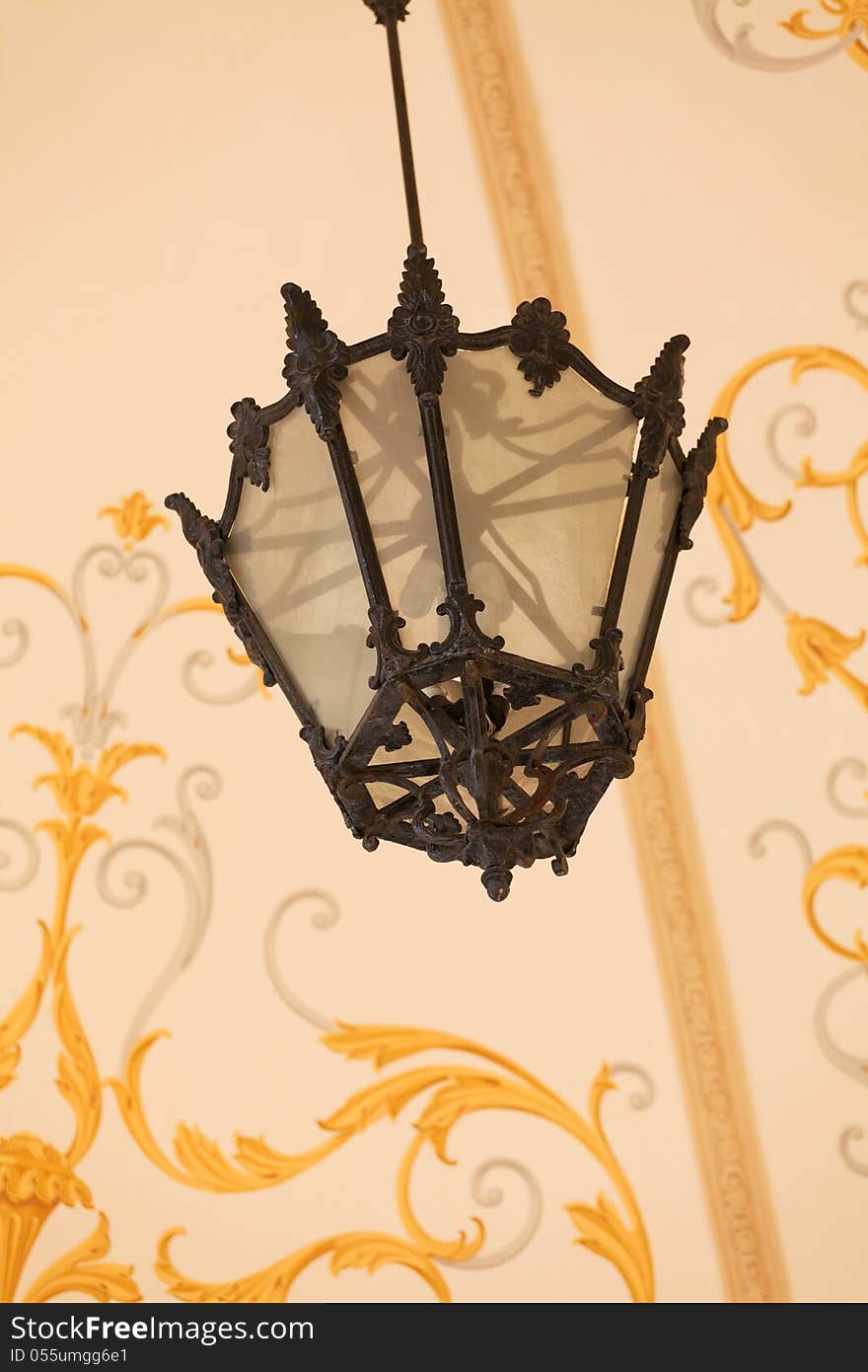 Ornate lantern on decorative background