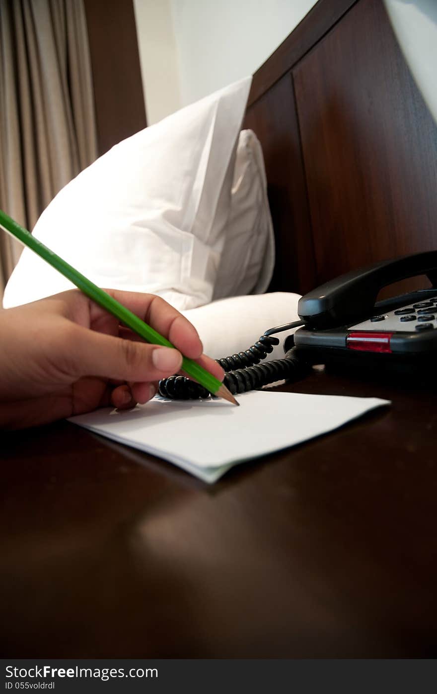 Businessman Writing With Pencil