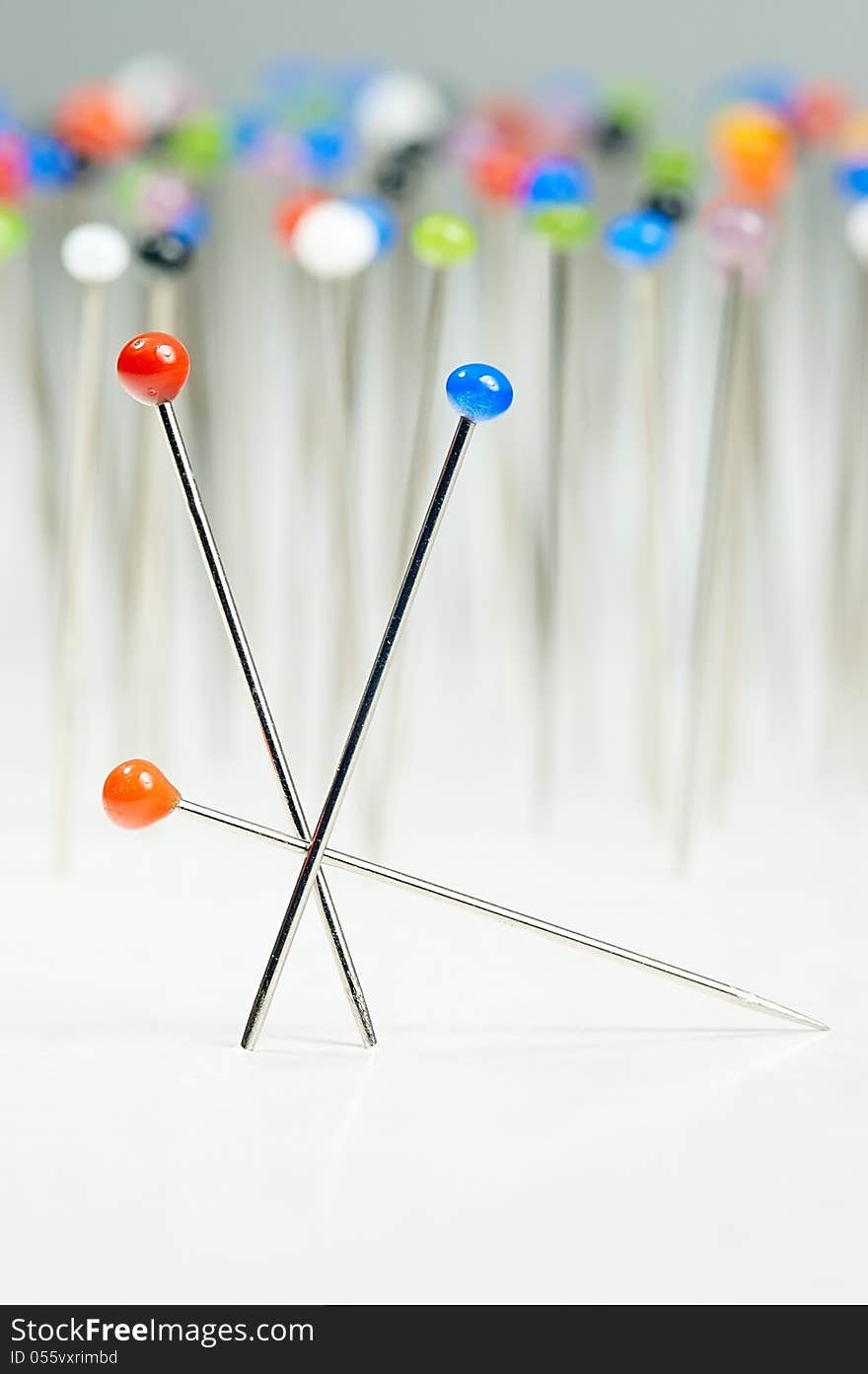 Different colored pins standing with background