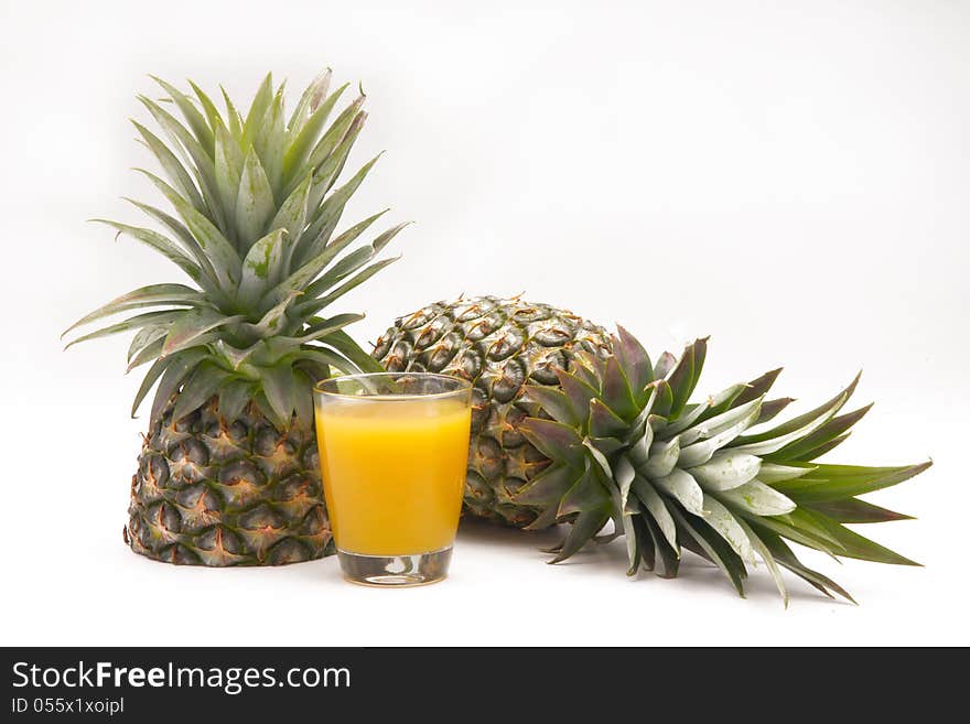 Pineapple with juice in white background. Pineapple with juice in white background.