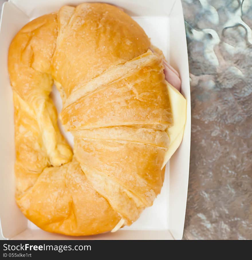 Ham cheese croissant placed on the table. Ham cheese croissant placed on the table.