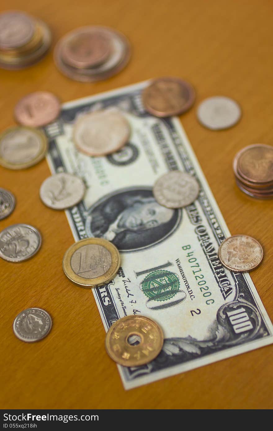 Money on a table - bills and coins.