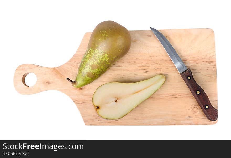 Pear, knife and chopping board