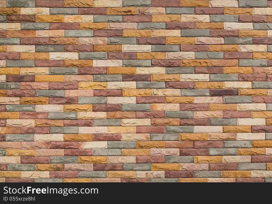 Multi color brick wall to design as background