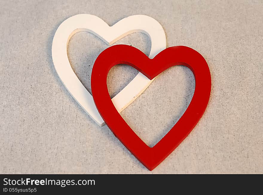 A white and a red heart with a white background. A white and a red heart with a white background