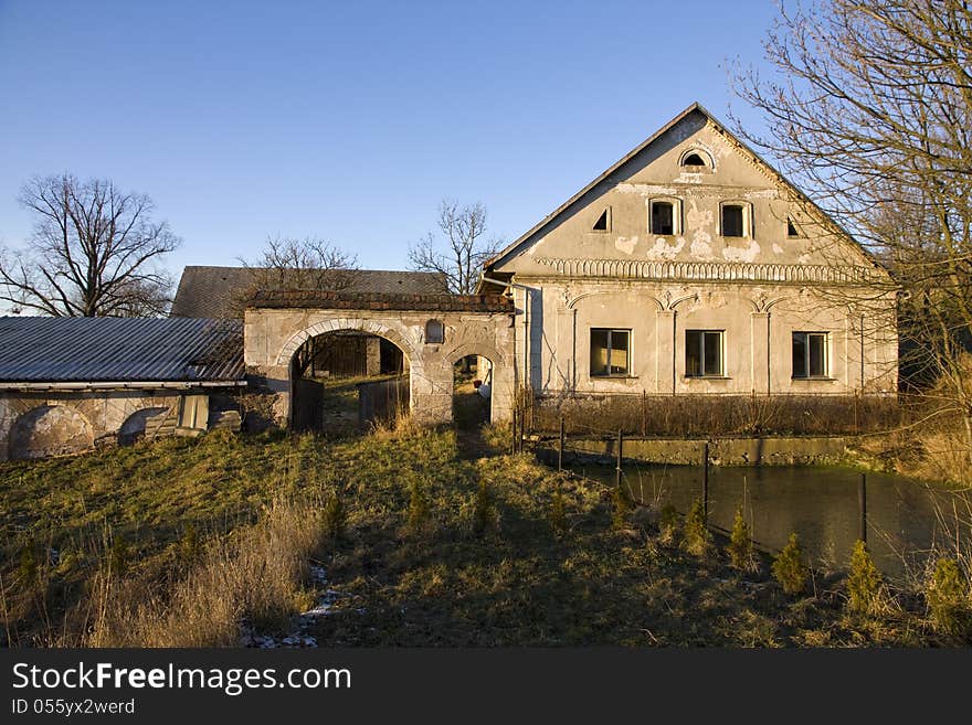 Old country house with a yard and a pond. Old country house with a yard and a pond