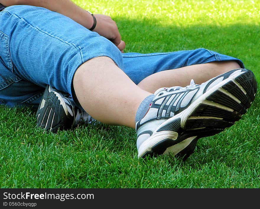 Man lying over the grass in the park. Man lying over the grass in the park