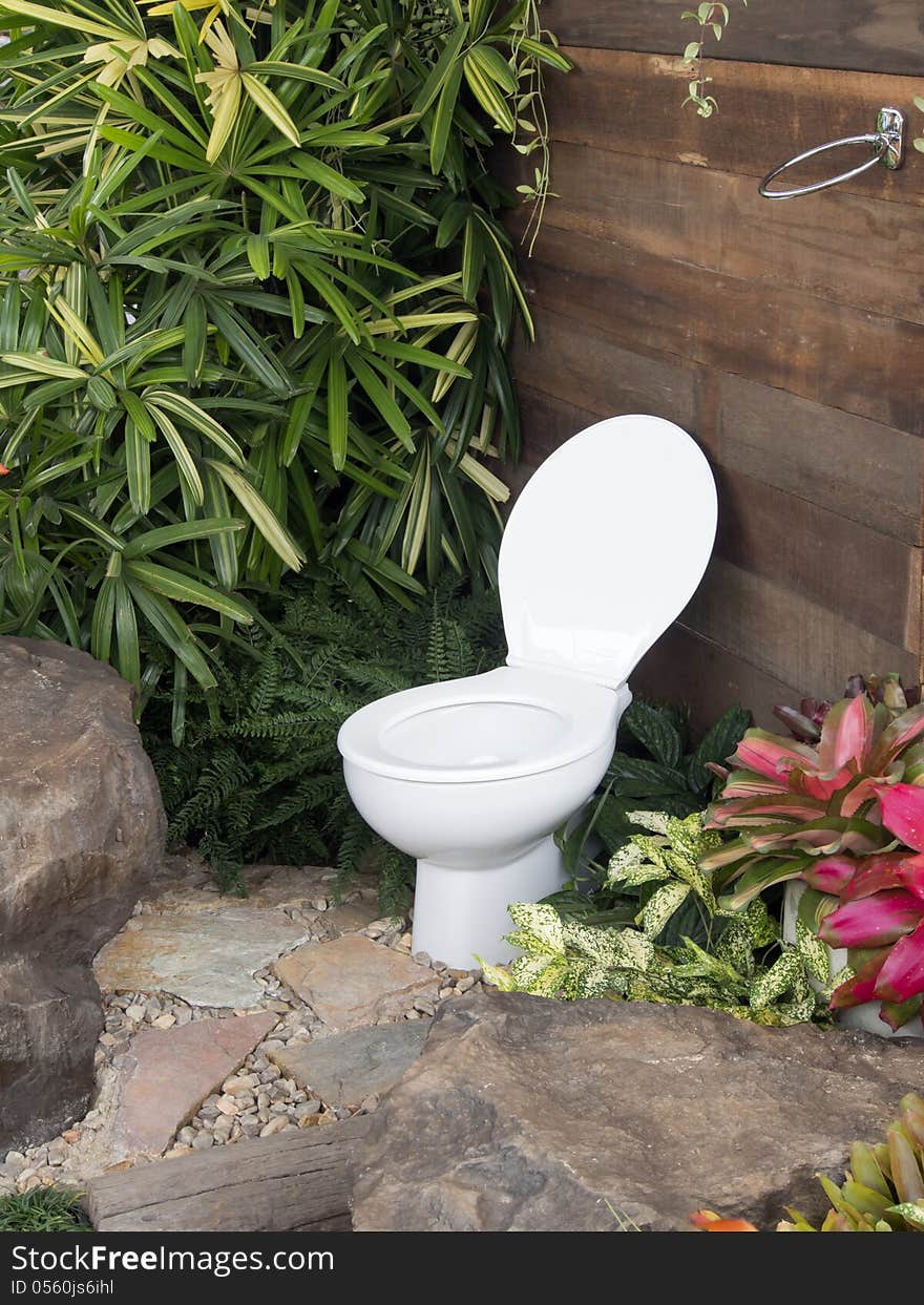 The white toilet in the garden. The white toilet in the garden