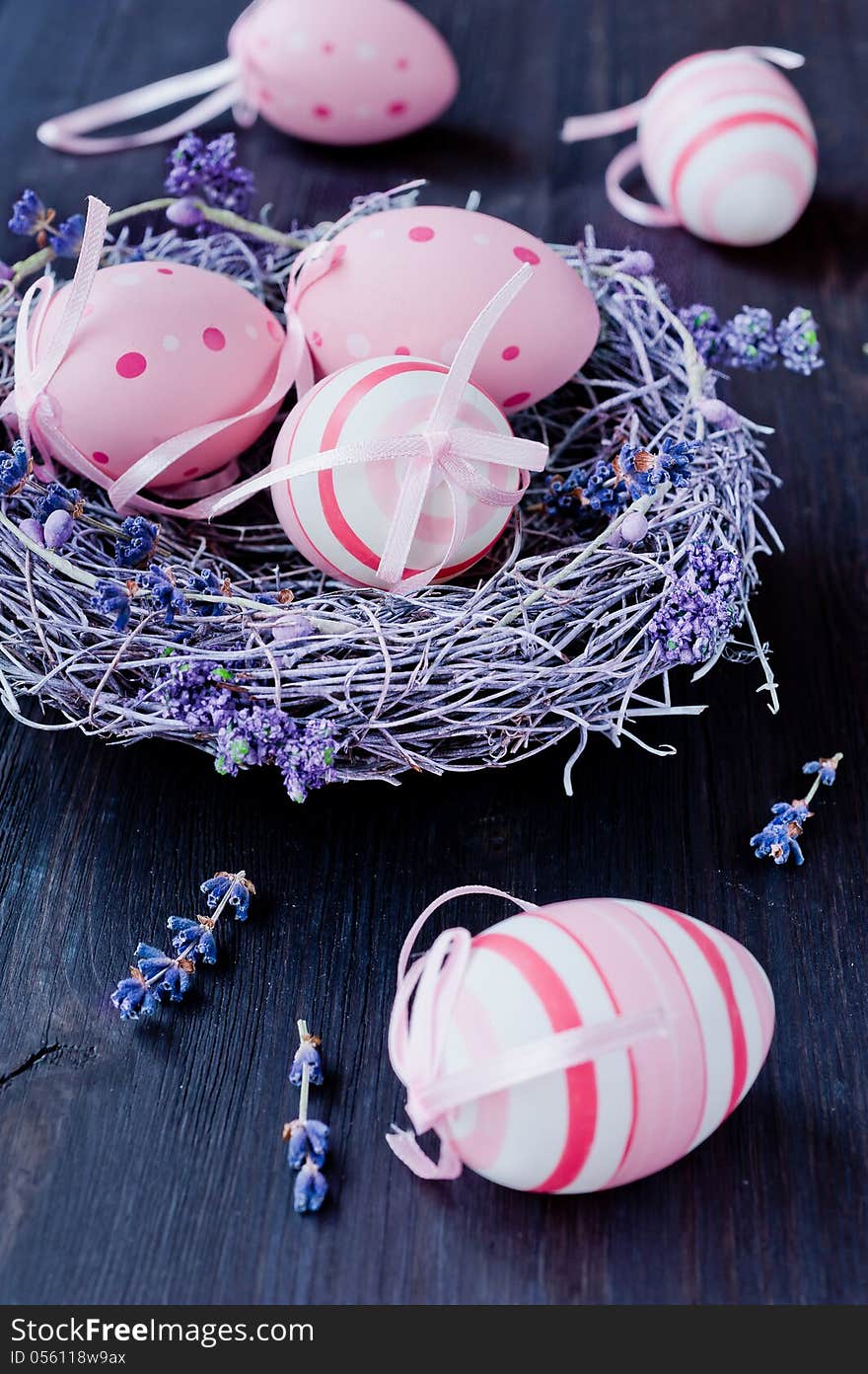 Easter eggs in a nest with lavender flowers. Easter eggs in a nest with lavender flowers