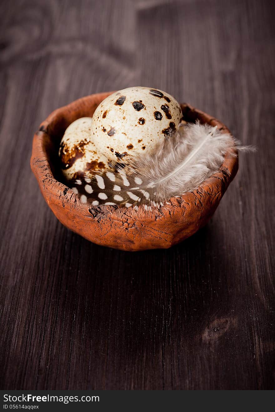 Quail eggs in a rustic bowl