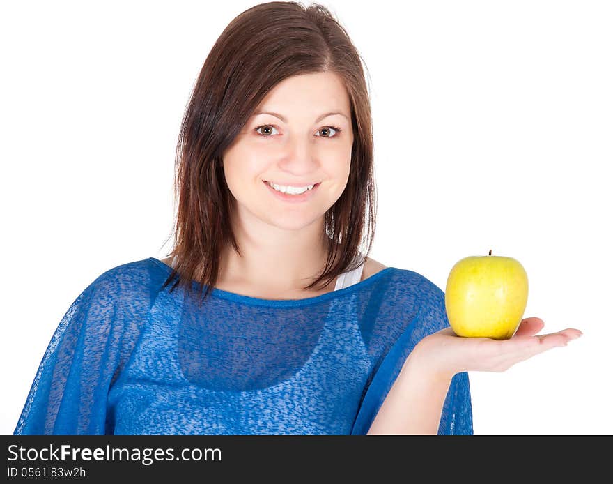 Beautiful young woman with green apple over white background.