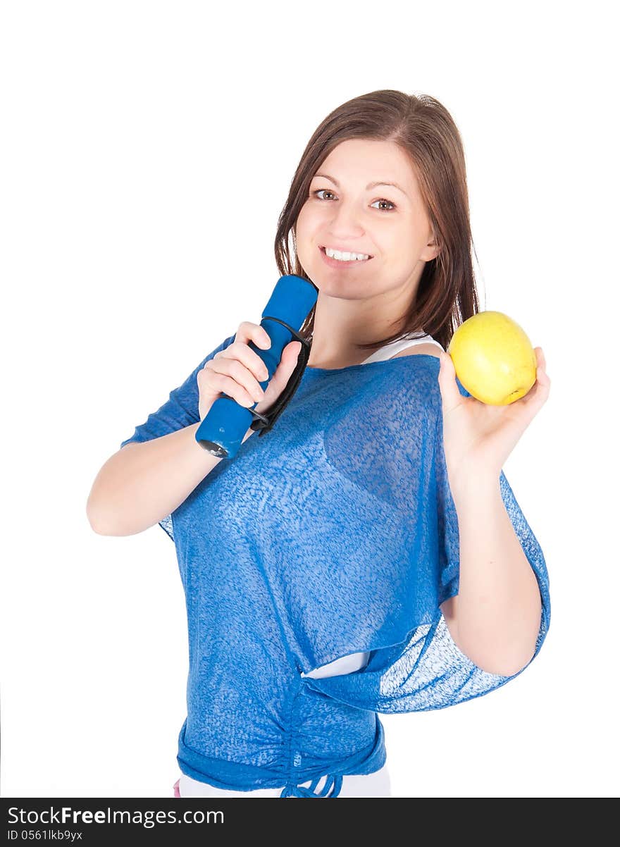 Beautiful young woman with green apple over white background.