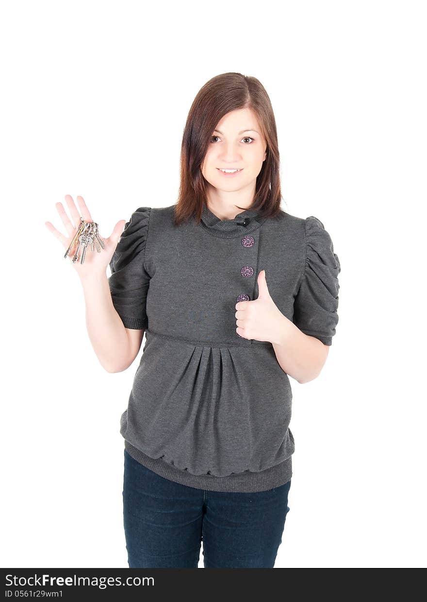 Young beautiful woman showing apartment keys on white background