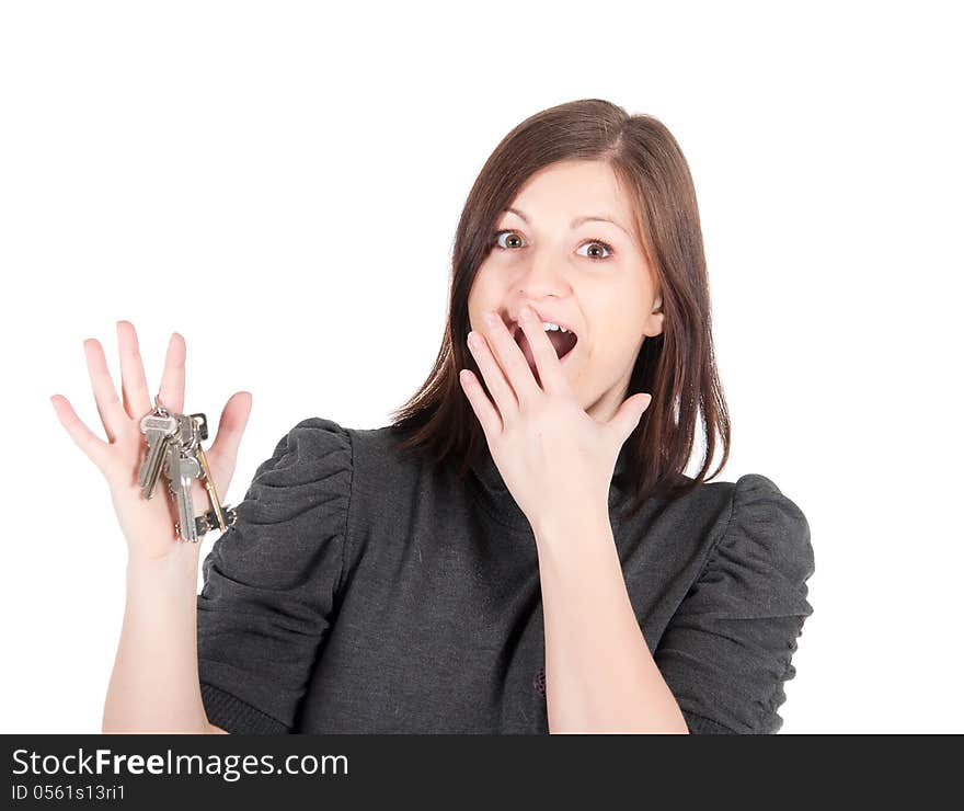 Young beautiful woman showing apartment keys on white background