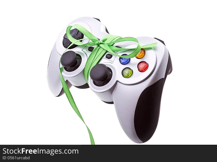 Festive cordless gamepad with a green festive bow. Isolated on white. Festive cordless gamepad with a green festive bow. Isolated on white.
