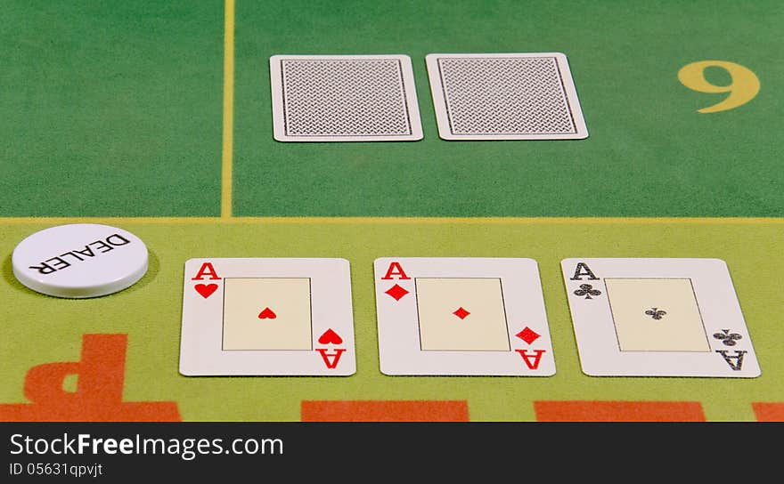 Poker cards and dealer button on the table.