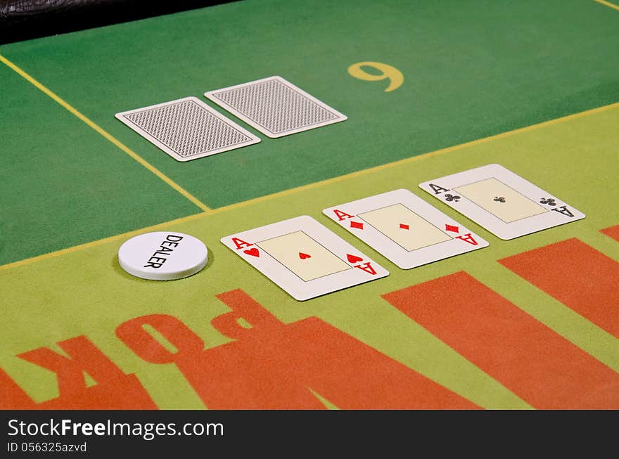 Poker cards and dealer button on the table.