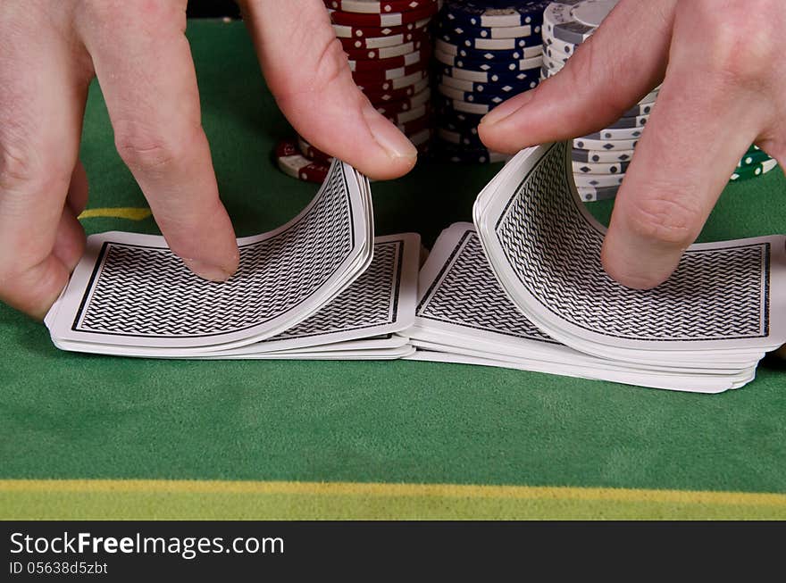 Poker player give the cards a shuffle