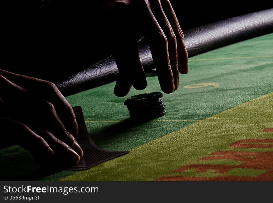 Poker Player In Back-light.