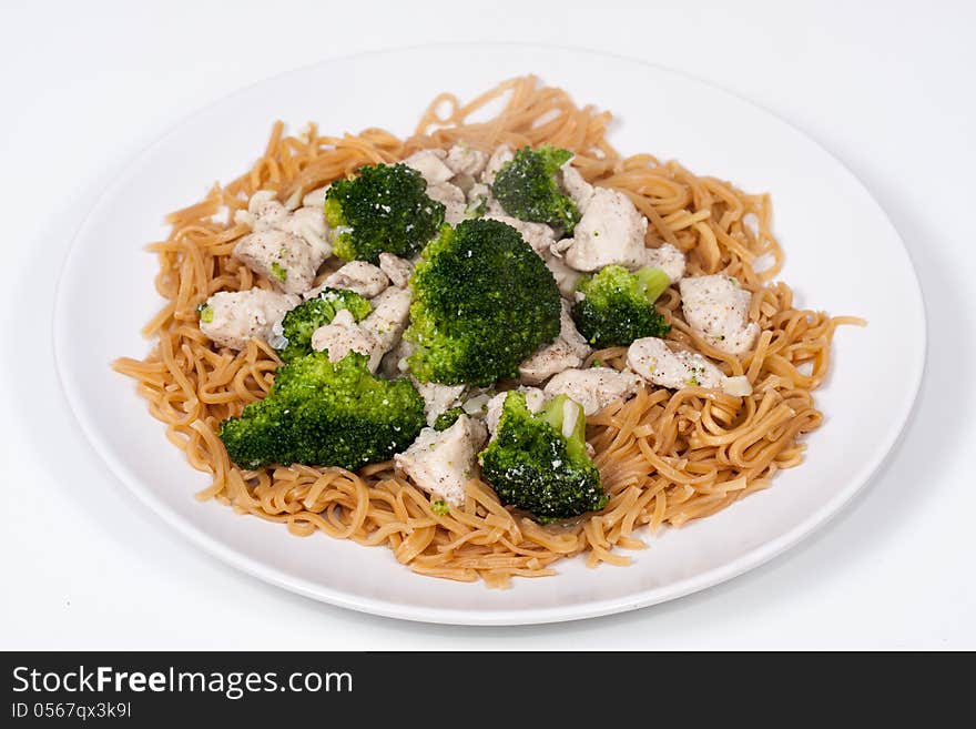 Stir fried Chinese Garlic Broccoli Chicken with egg noodles ready to serve. Stir fried Chinese Garlic Broccoli Chicken with egg noodles ready to serve