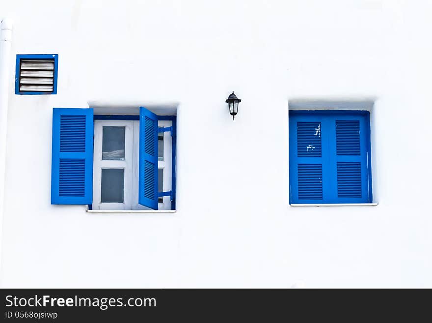 Twin blue window with white wall