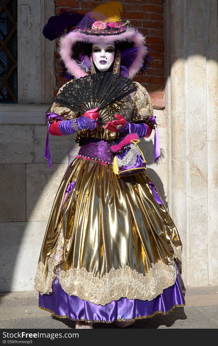 A mask with a black fan in The Carnival of Venice, 2013 edition