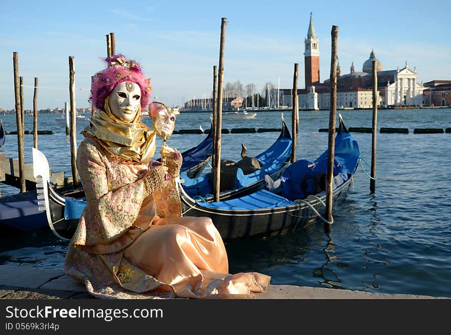 A venetian mask in front of San Giorgio isle