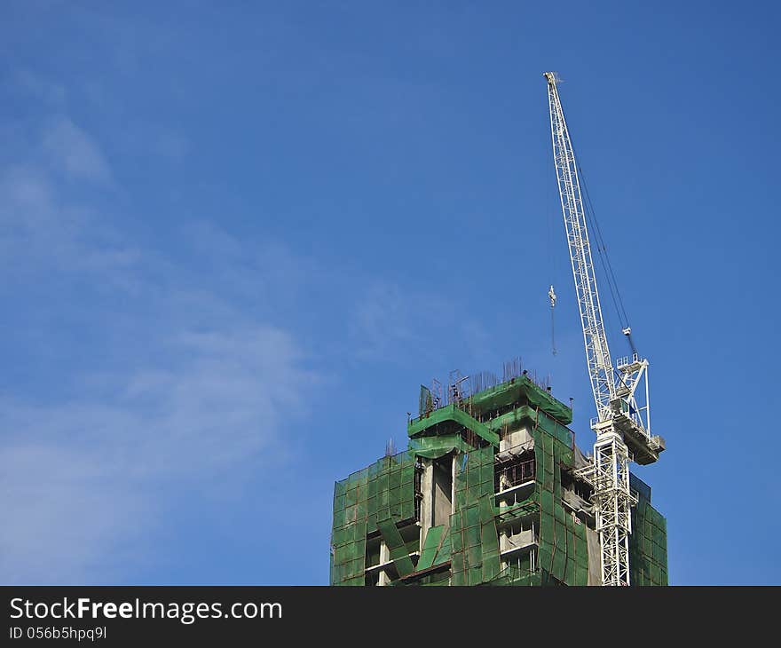 Hight crane is install at side of building. Hight crane is install at side of building