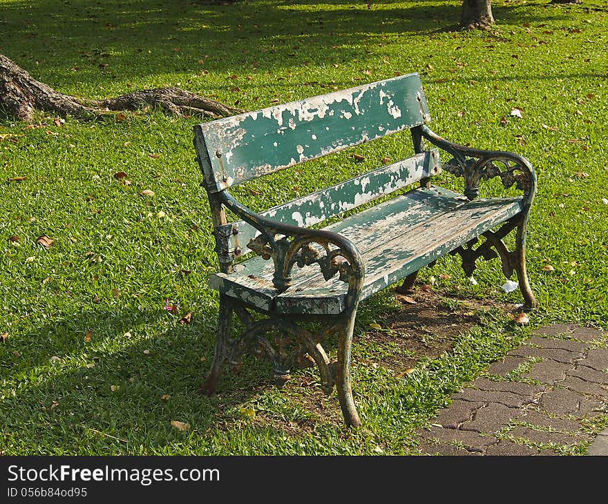 Old green empty bench in pubic park. Old green empty bench in pubic park