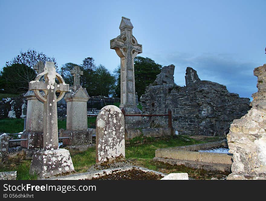 Spooky Graveyard at dusk with crosses and headstones. Spooky Graveyard at dusk with crosses and headstones