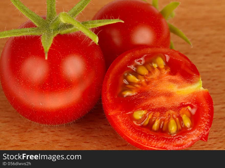 Red tomatoes in wood background