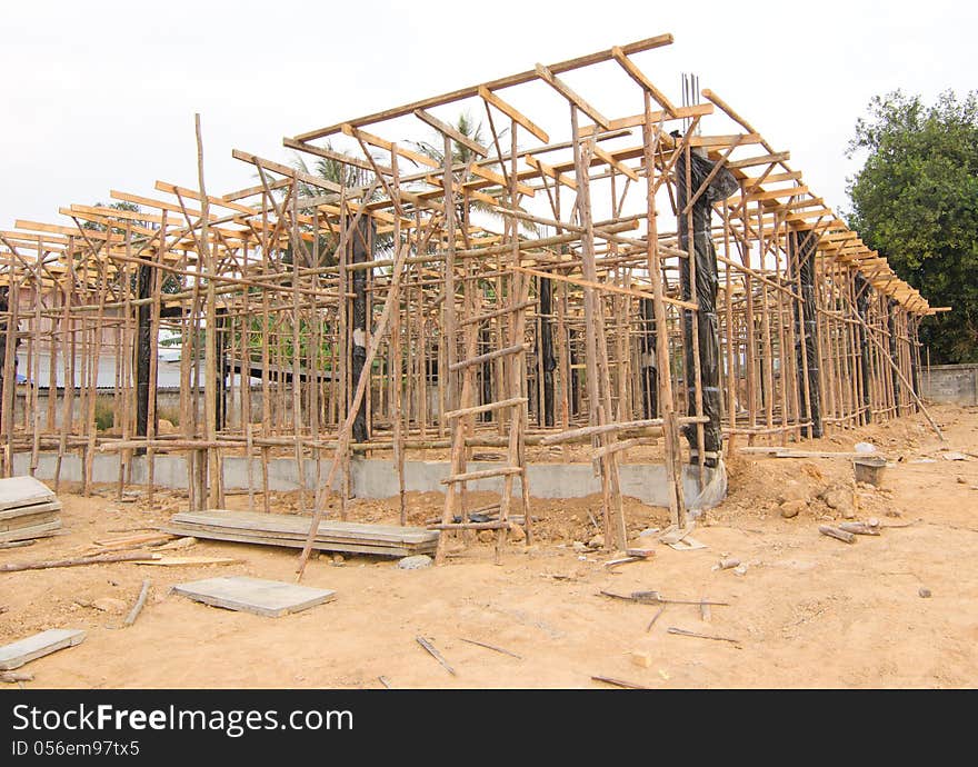 House under construction with the structure of wood