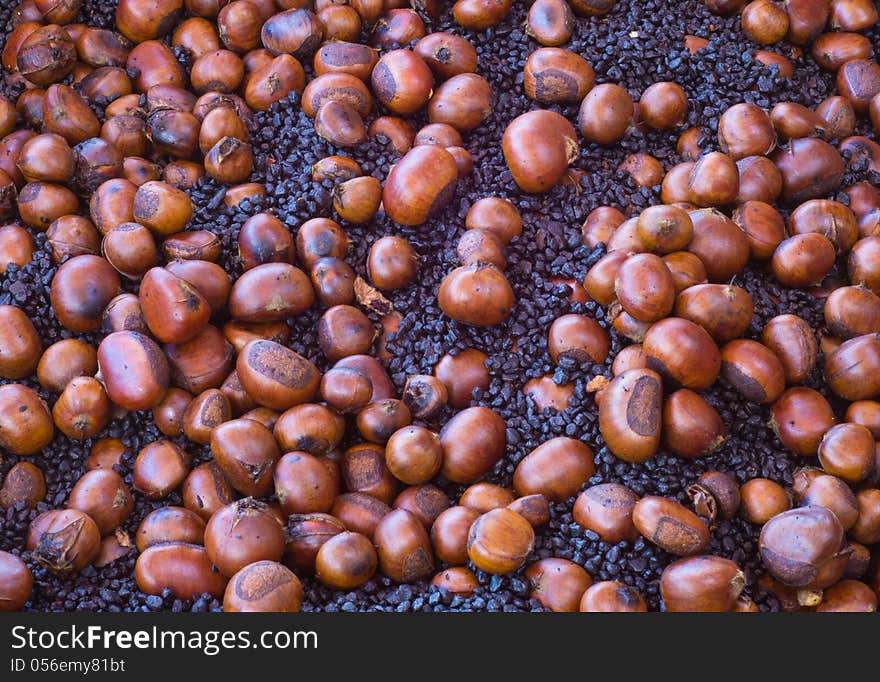 Many roast chestnuts for sale in Thailand market.