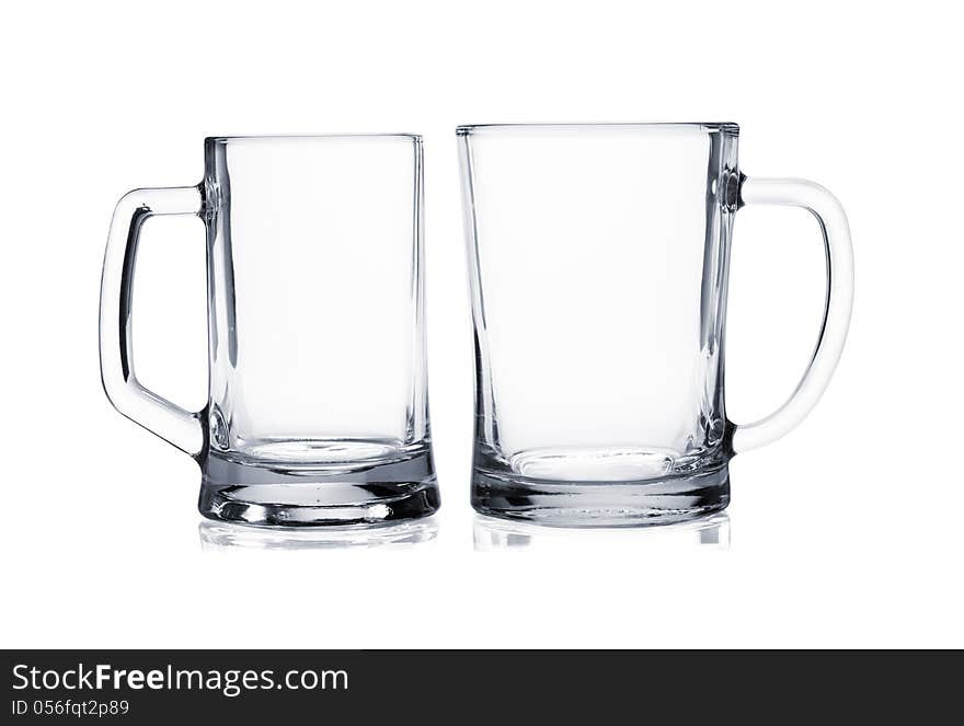 Two empty beer mugs on white background