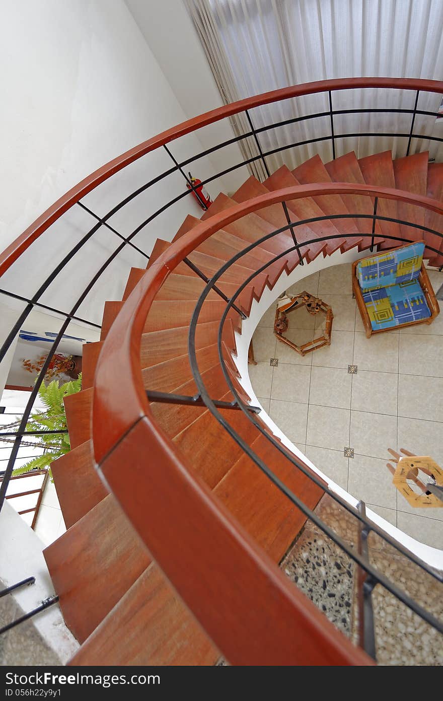 Image taken in San Bartolo, Lima, Peru, 2009. Image shows spiral staircase from first floor looking down to ground within a local hostel. A wide angle lens was used to exaggerate the effect of the of spiral staircase.