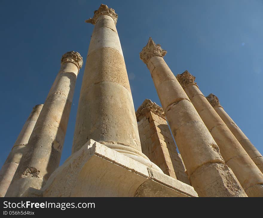 This photo was taken in jerash jordan, of the temple of artemis.  as most days are in the middle east, there was not a cloud in the sky.  i was awed by how impressive the pillars looked today, and could only imagine how inspiring they were when this was built. This photo was taken in jerash jordan, of the temple of artemis.  as most days are in the middle east, there was not a cloud in the sky.  i was awed by how impressive the pillars looked today, and could only imagine how inspiring they were when this was built.