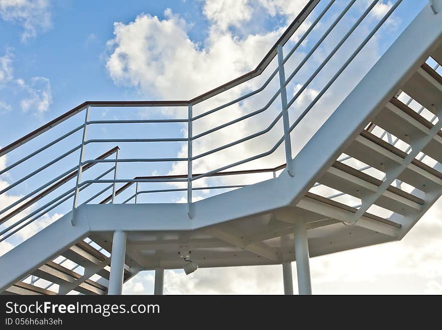 Metal staircase with blue sky. Metal staircase with blue sky