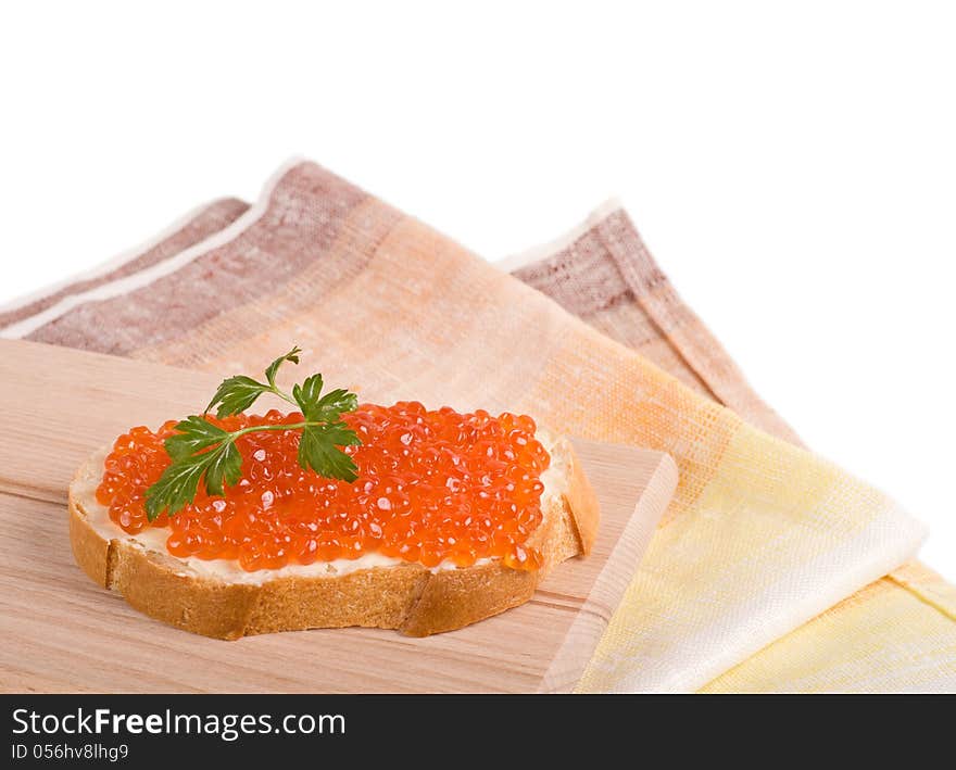 Bread with red caviar and parsley