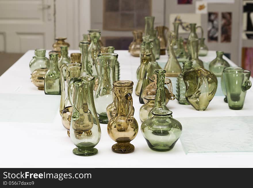 Many glass vases on a table