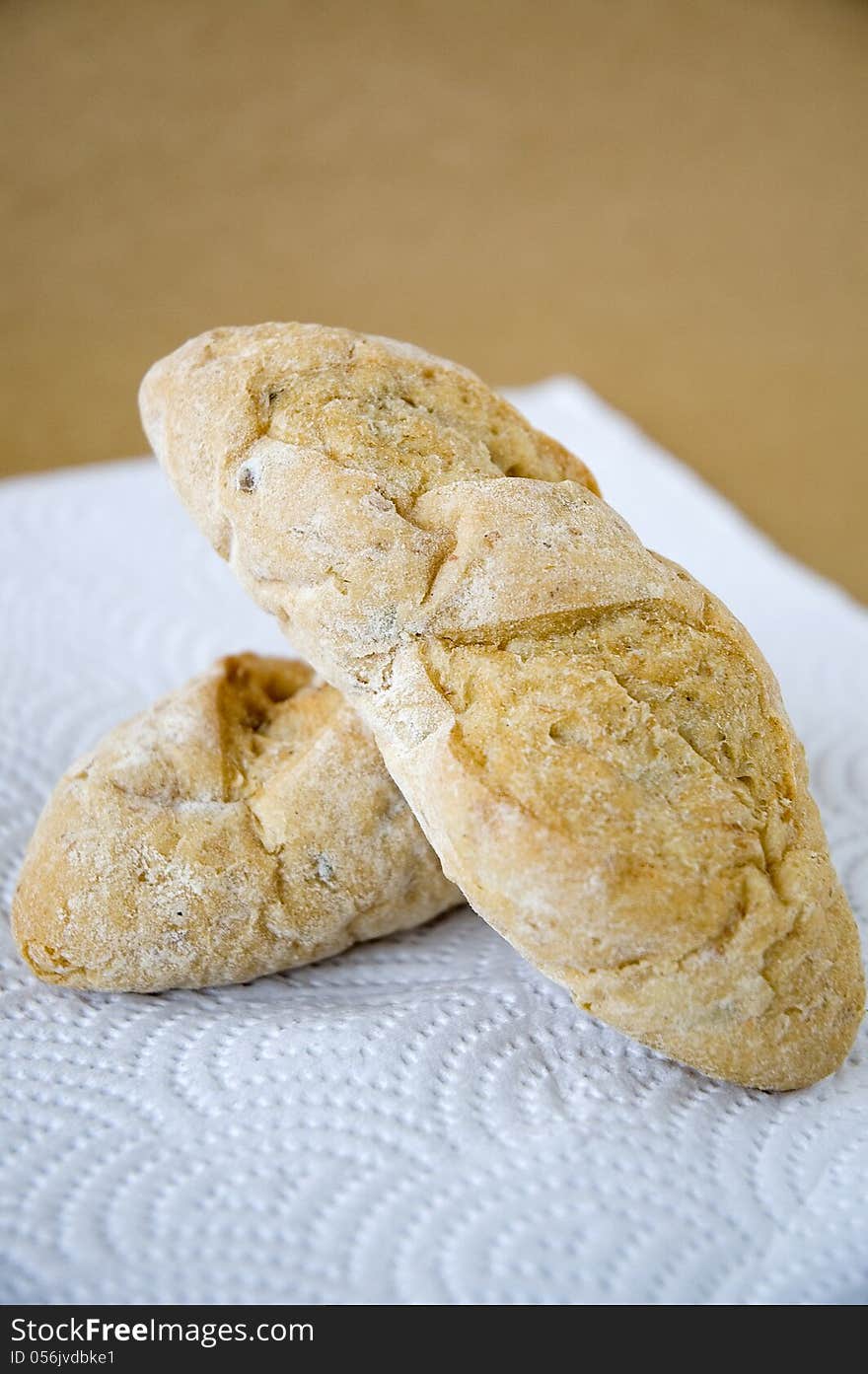 Fresh bread on brown background