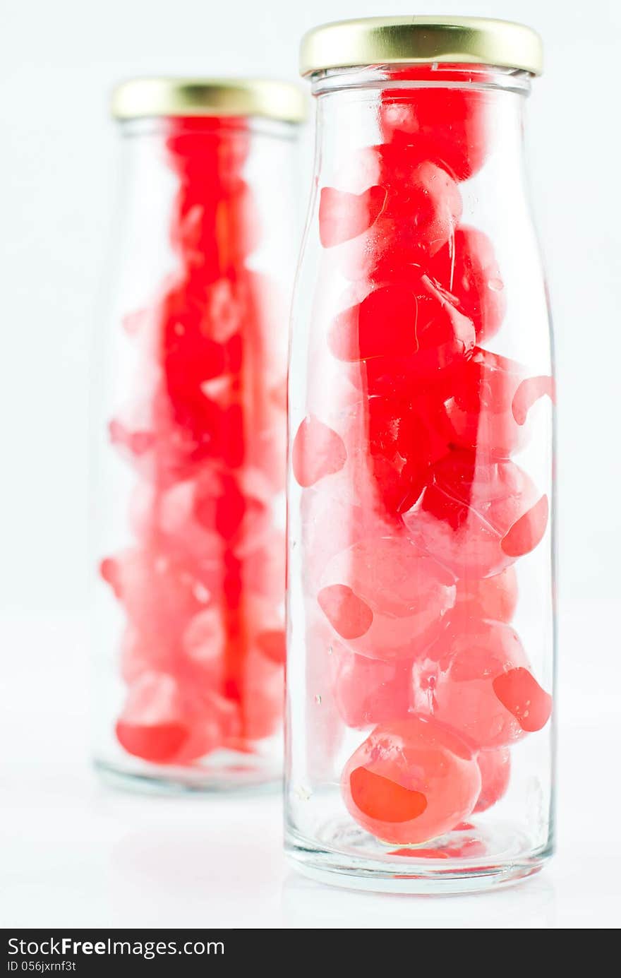 Glass of cherry compote on a white background. Glass of cherry compote on a white background