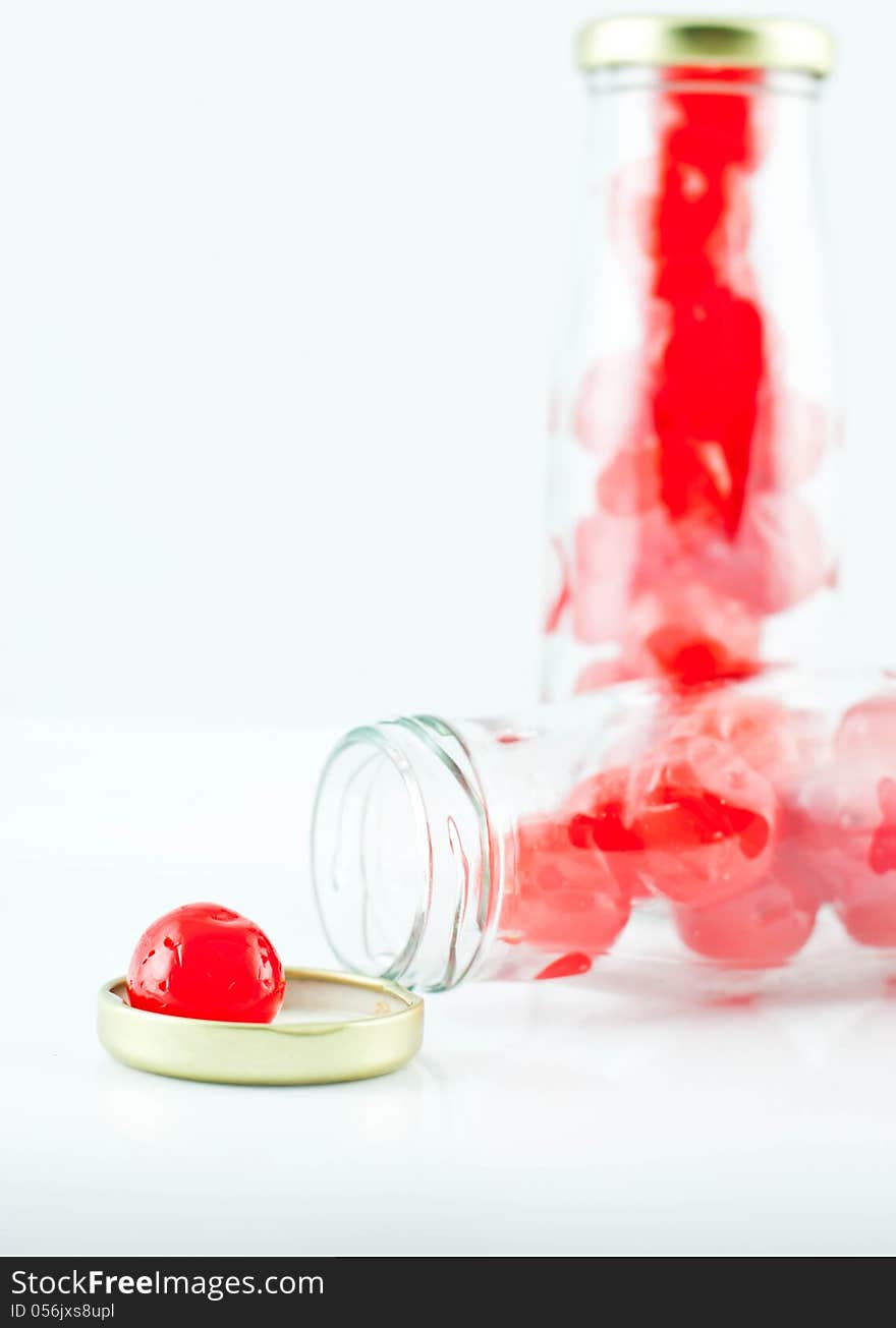 Glass of cherry compote on a white background. Glass of cherry compote on a white background