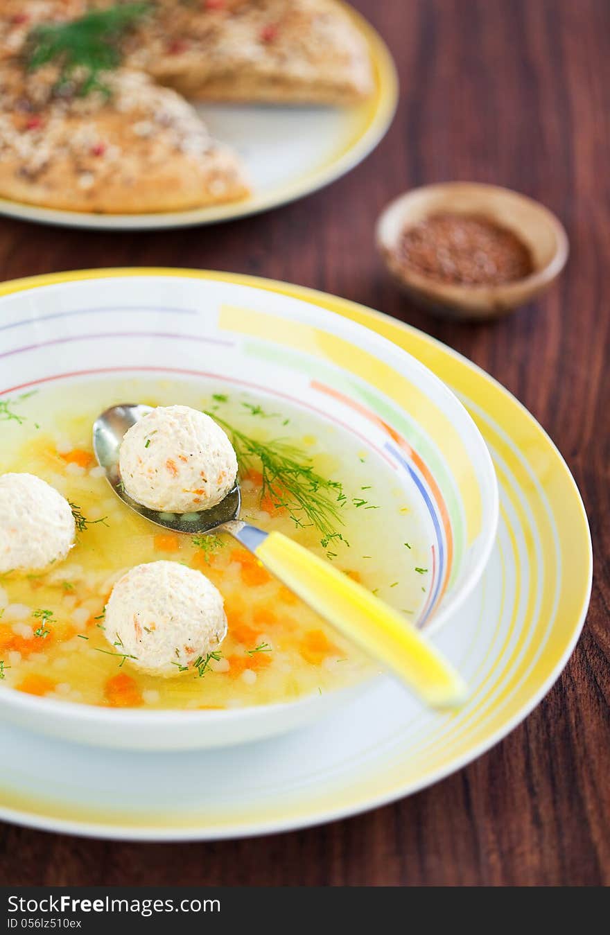 Soup with turkey meatballs, carrots and tselery, selective focus