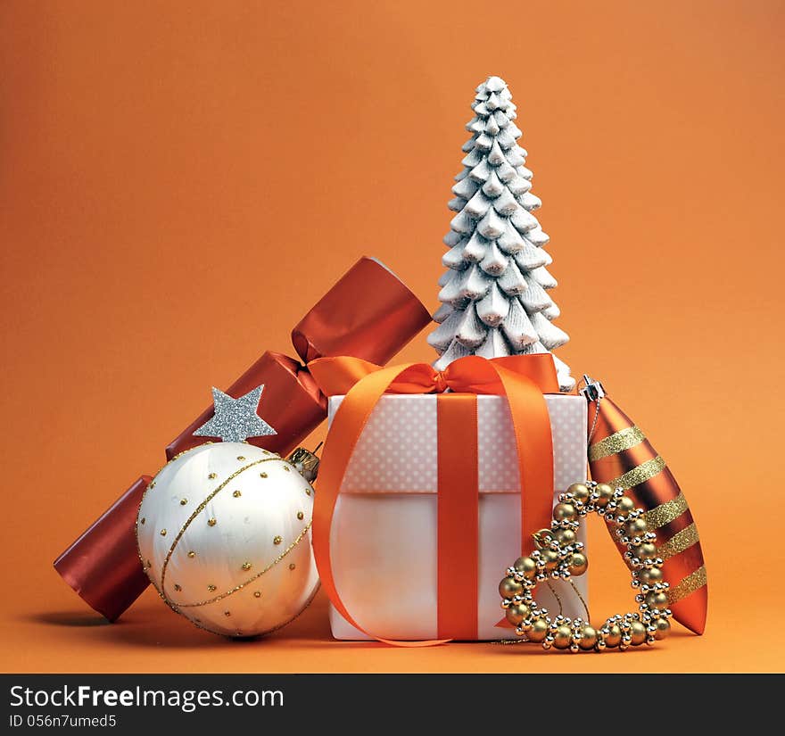 Orangetheme Christmas gift and bauble decorations festive holiday still life. Orangetheme Christmas gift and bauble decorations festive holiday still life.