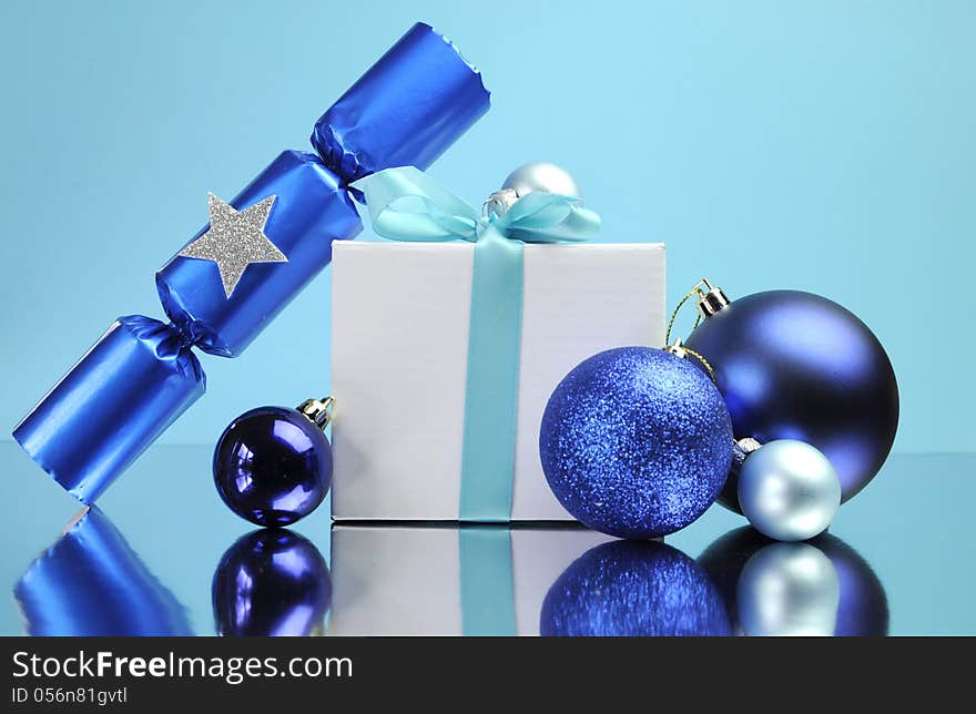 Blue theme Christmas gift and bauble decorations festive holiday still life.