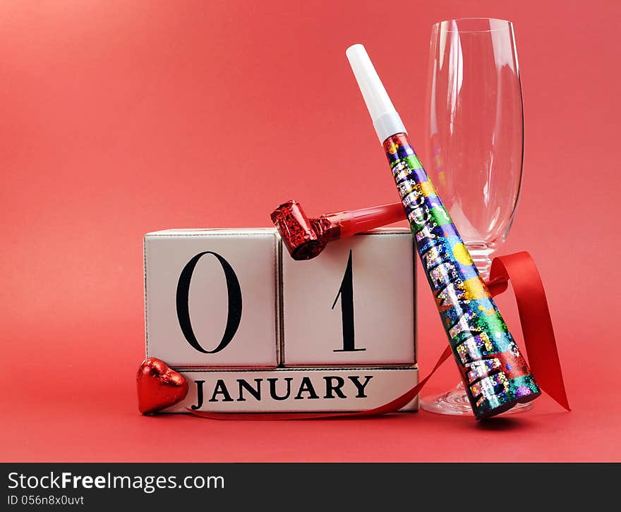 Red theme Save the date with a Happy New Year, January 1, block calendar, with champagne glass and party whistles.