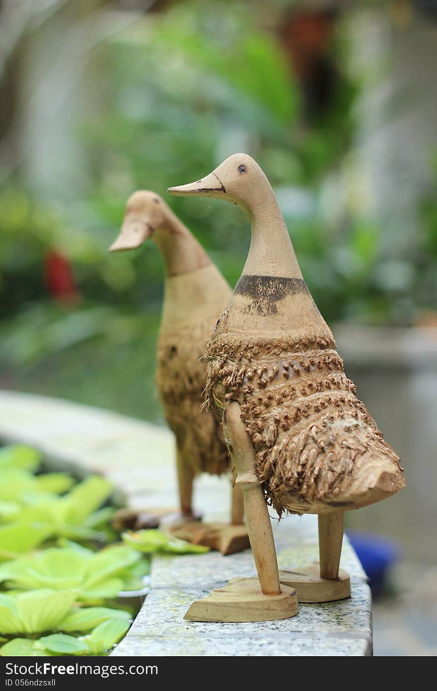 Bamboo duck on basin edge